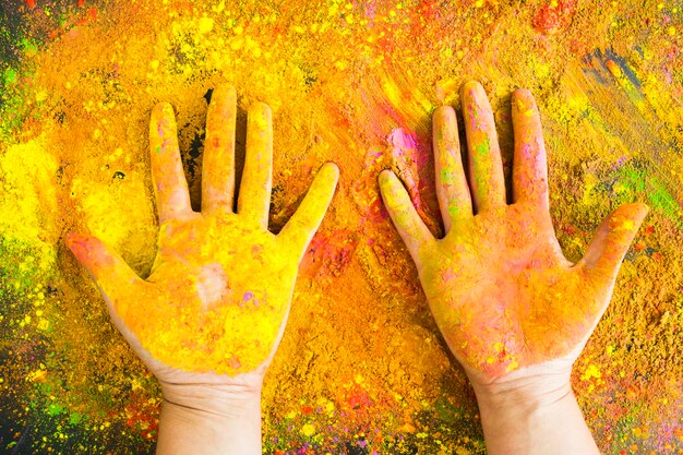 Hands covered with painted powder