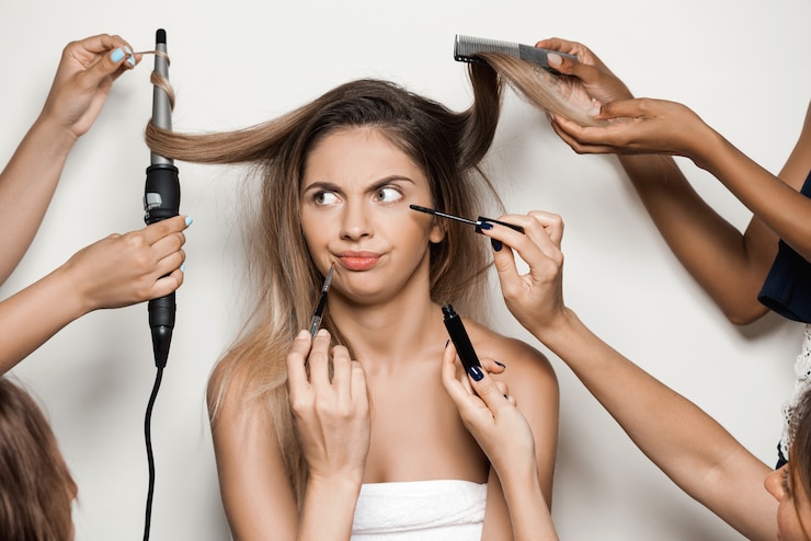 Free Photo hands doing make up and hairstyle of young beautiful woman