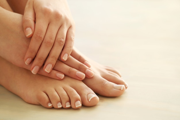 Free Photo hands and feet of a woman