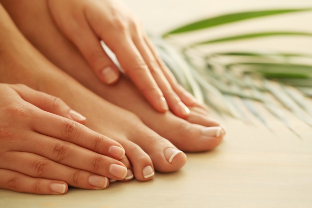 Free Photo hands and feet of a woman