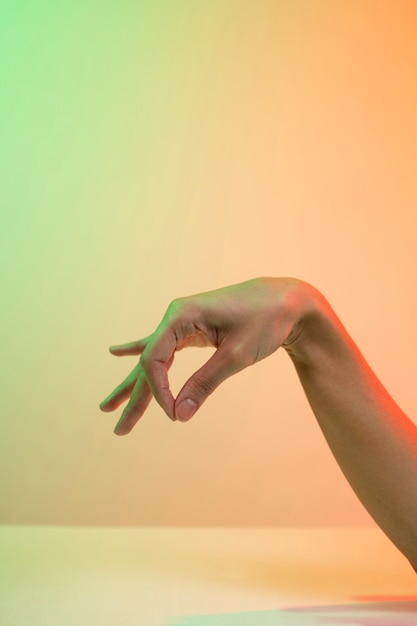 Free photo hands gesturing over gradient background