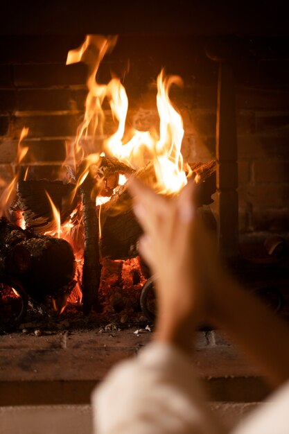 Hands getting warmer by the fire close up