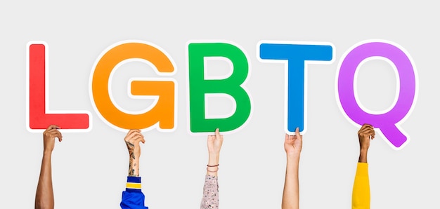 Free Photo hands holding the abbreviation lgbtq