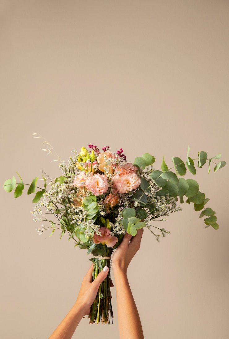 Free Photo hands holding beautiful boho flowers
