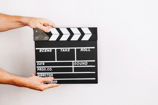 Hands holding clapboard
