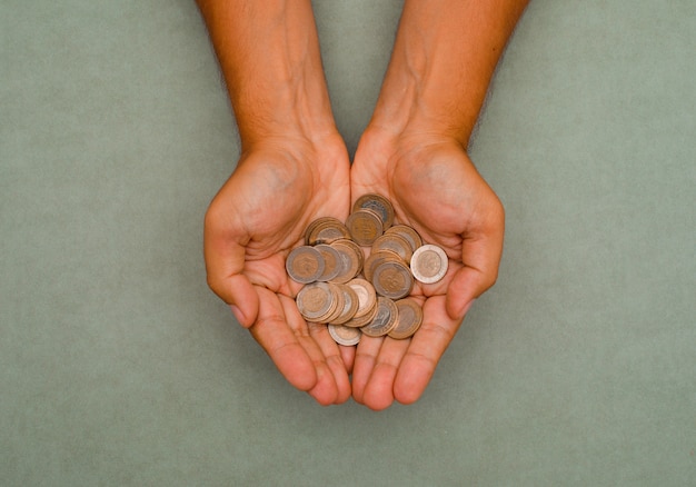 hands holding coins.