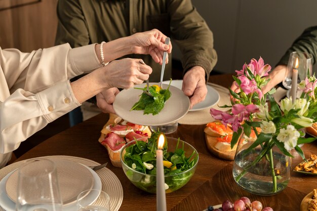 Hands holding cutlery close up