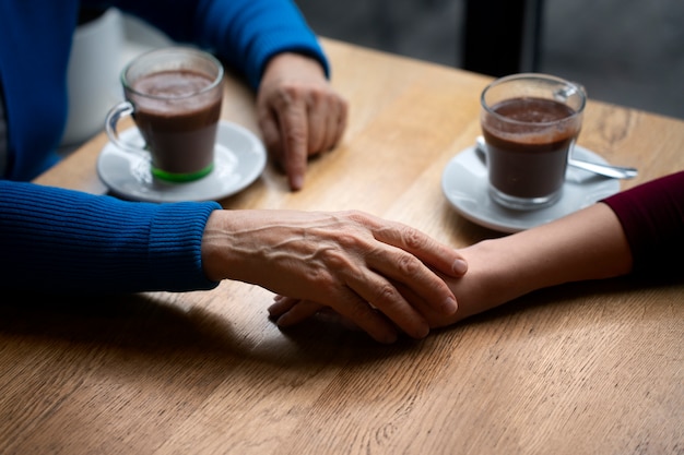 Hands holding each other for support