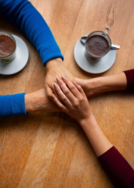 Hands holding each other for support