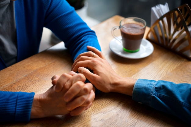 Hands holding each other for support