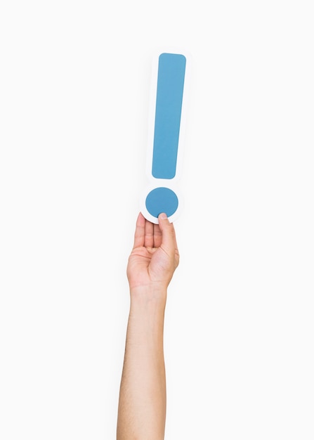 Hands holding exclamation point symbol