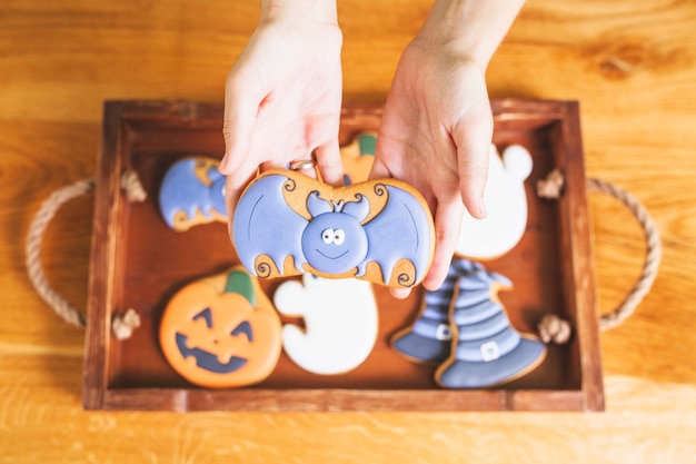 Free photo hands holding funny gingerbread