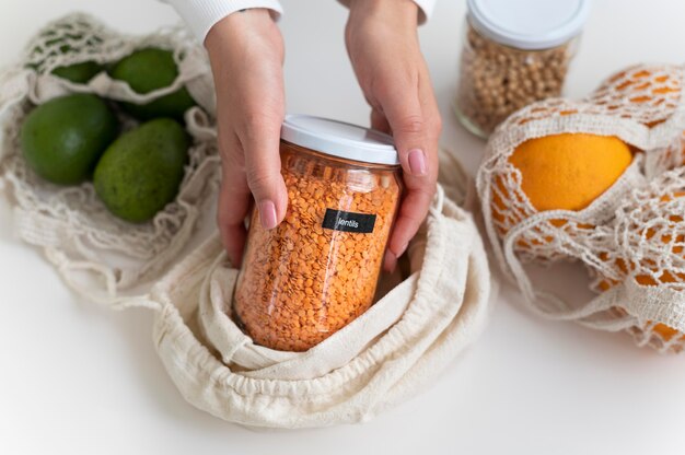 Hands holding jar close up