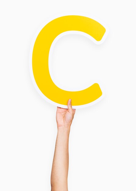 Hands holding the letter C