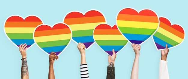 Hands holding a lgbt rainbow heart graphic