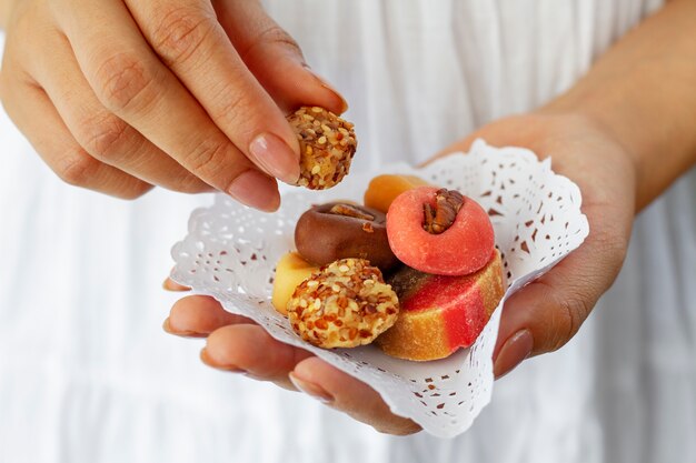 Hands holding mexican sweets high angle