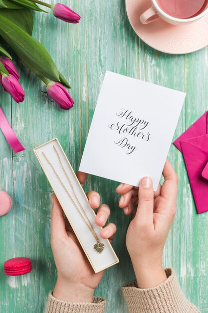 Hands holding mother's day gifts