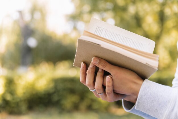 Hands holding open book