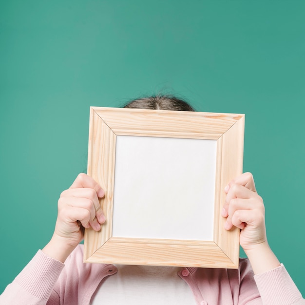 Hands holding picture frame