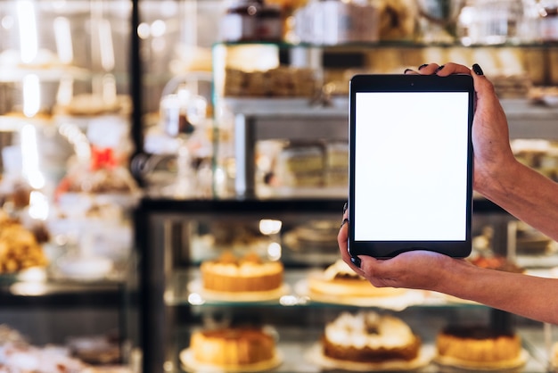 Free photo hands holding tablet