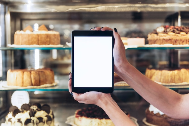 Hands holding tablet