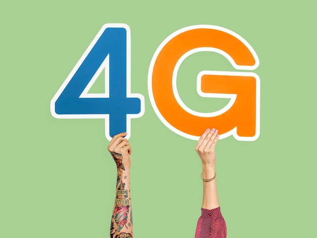 Free photo hands holding up colorful letters forming the abbreviation 4g