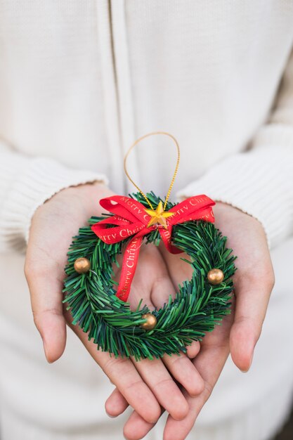 Hands holding wreath