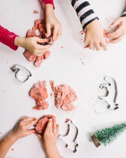 Hands making christmas figures