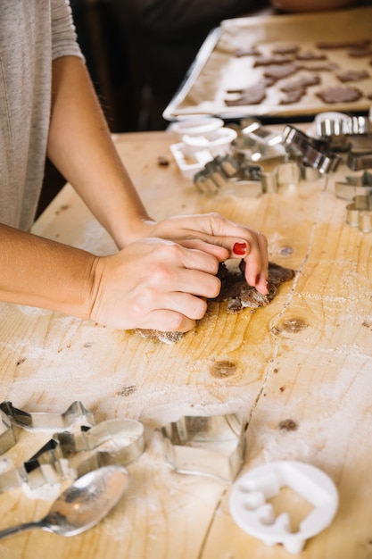 Hands making gingerbread