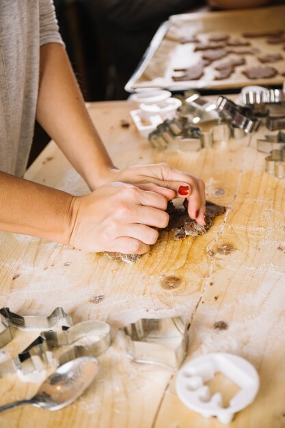 Hands making gingerbread