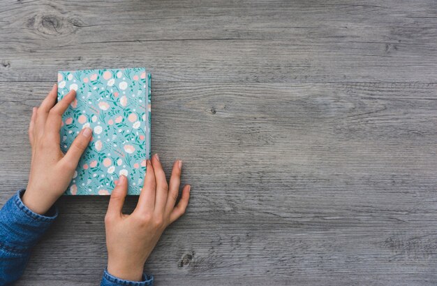 Hands opening a book