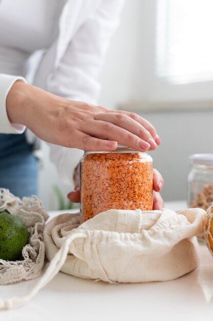 Hands opening jar close up