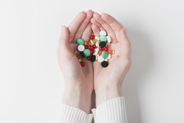 Hands of patient with pills