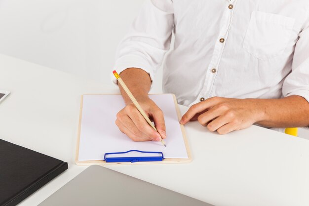 Hands, pencil and clipboard