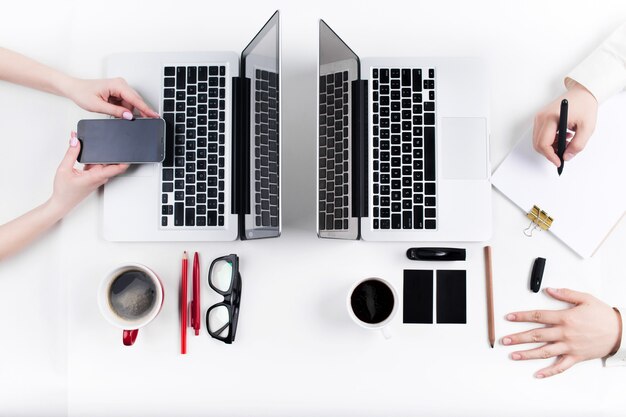 Hands of people working in the office. Technology.