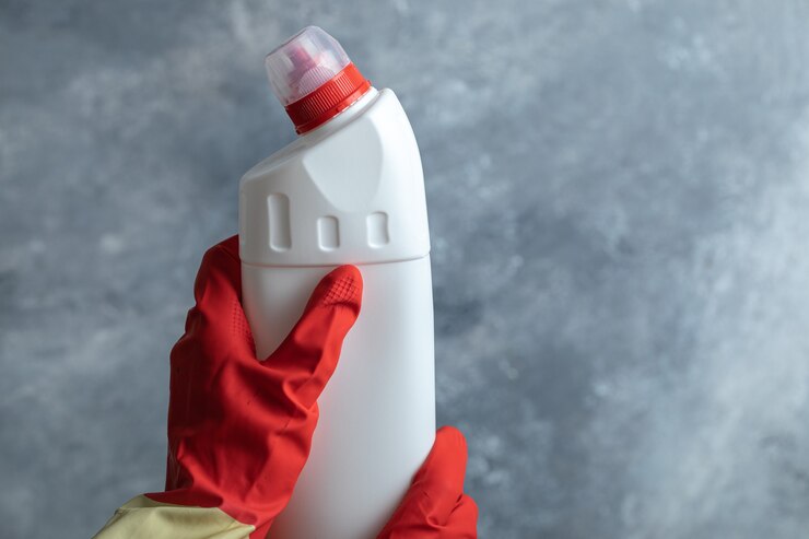 Free Photo hands in protective gloves holding cleaning supply.