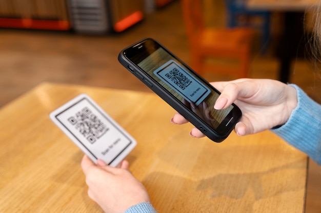 Free photo hands scanning qr code close up