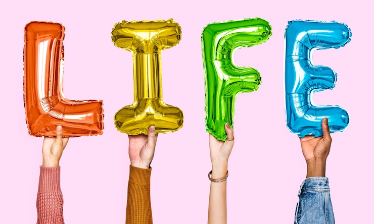 Free Photo hands showing life balloons word