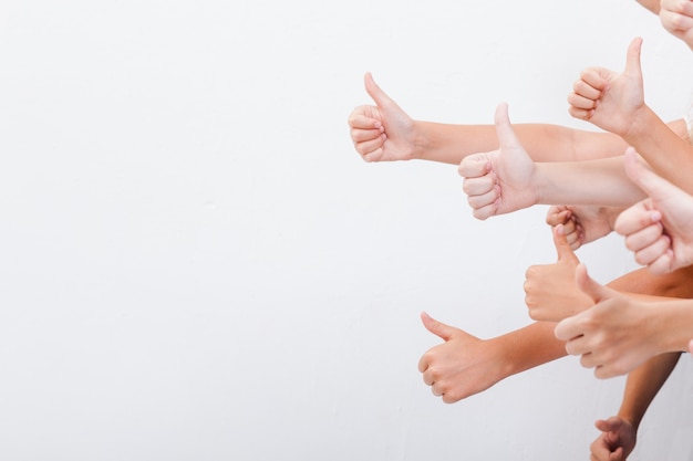 Hands of teenagers showing okay sign