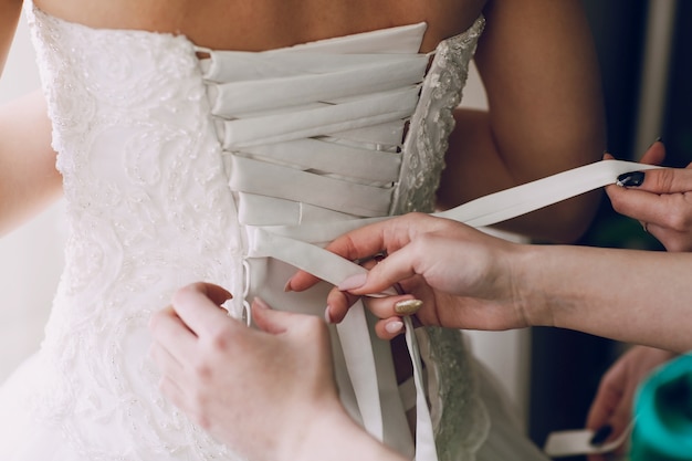 Hands tightening  wedding corset