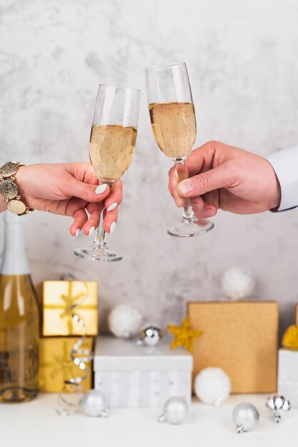 Hands toasting champagne glasses