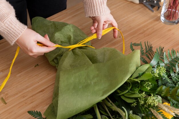 Hands tying ribbon close up