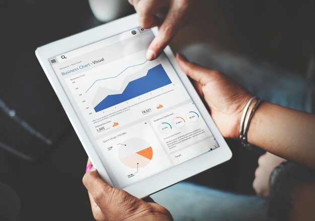 Hands Using Tablet Screen Showing Statistics Business Data