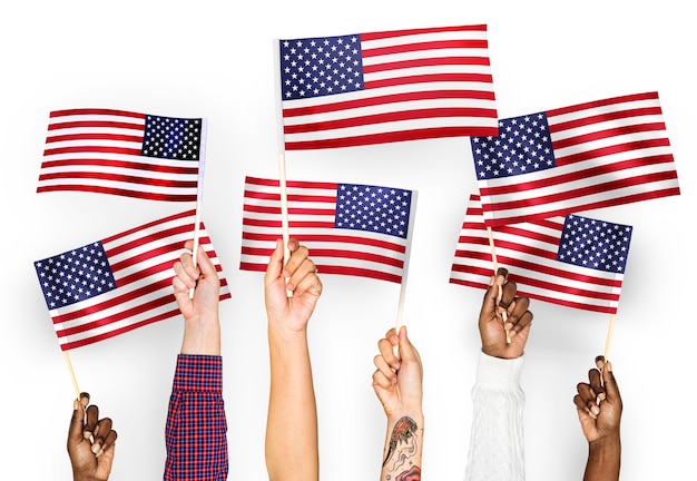 Free photo hands waving flags of the united states