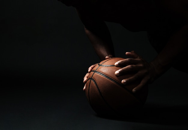 Hands with basketball ball