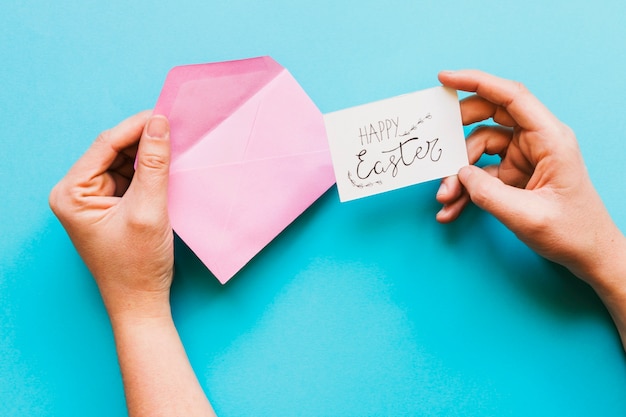 Hands with envelope and Easter greeting