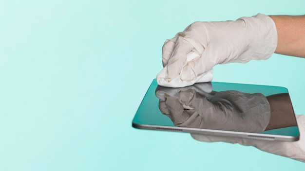 Hands with surgical gloves disinfecting tablet