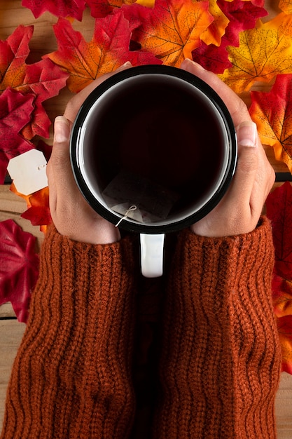 Free photo hands with tea, top view