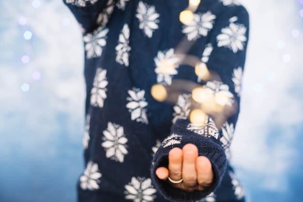 Hands of woman wearing pullover