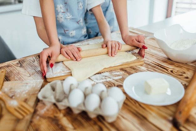 Hands working with dough preparation recipe